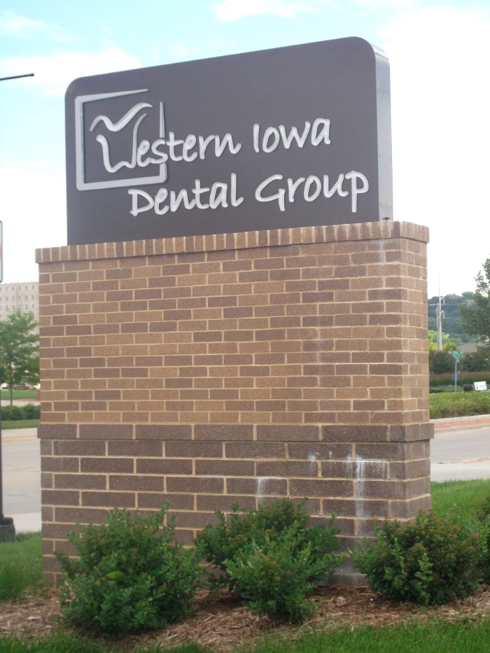 Illuminated, double-face Western Iowa Dental Group monument sign in Council Bluffs