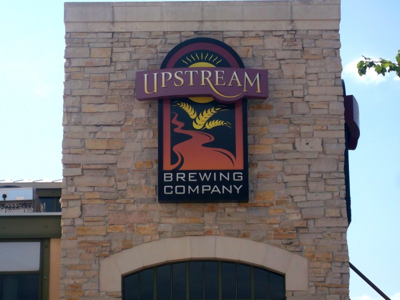 Illuminated Upstream signage cabinet at the Shops of Legacy at 168th and West Center