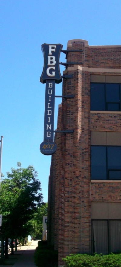 Illuminated, double-face projectingsign for the FBG Building