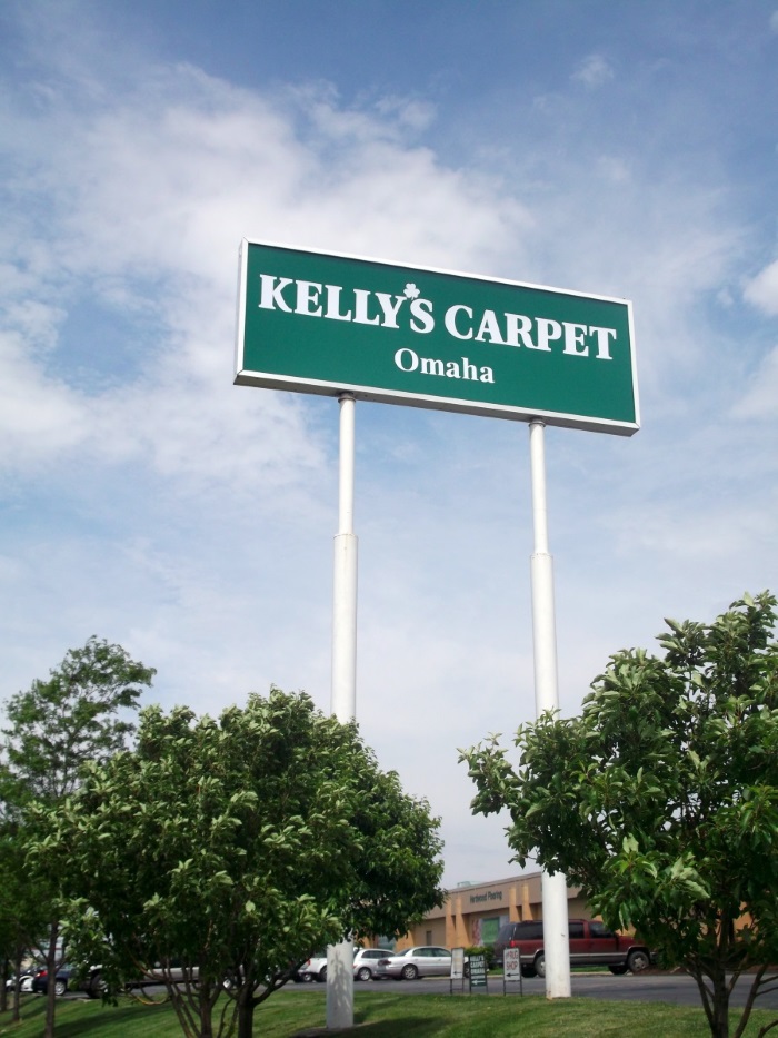 Illuminated, double-face Kelly's Carpet pole sign
