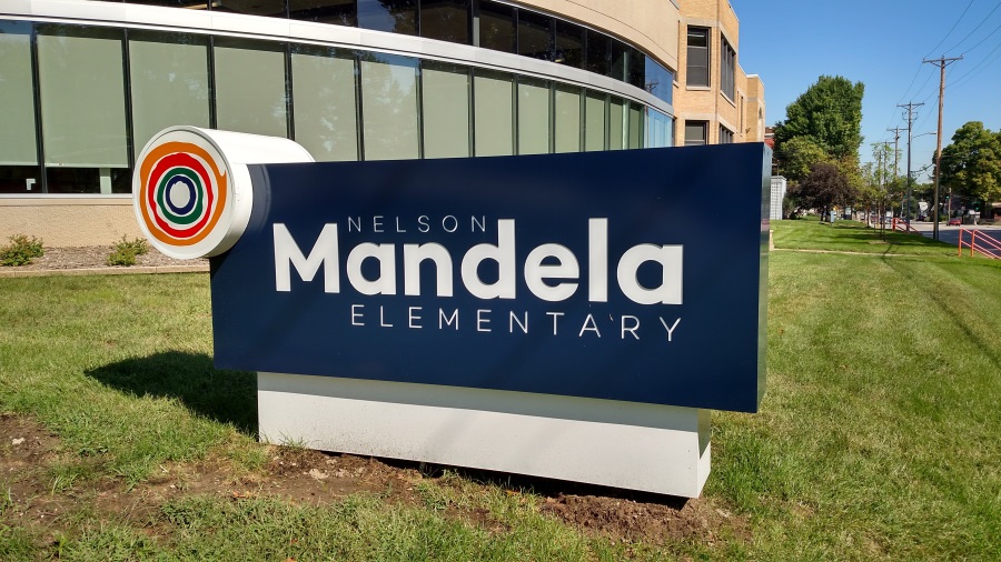 Illuminated, double-face monument sign at Nelson Mandela Elementary's southeast elevation